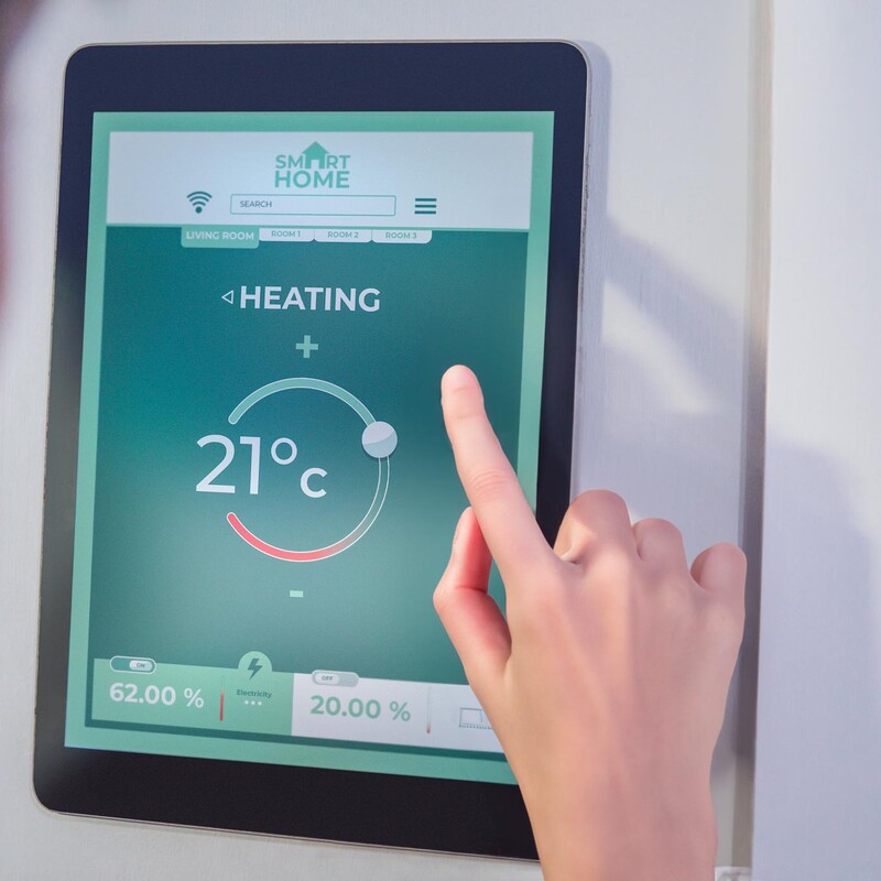 Person operating a heater via a touch screen