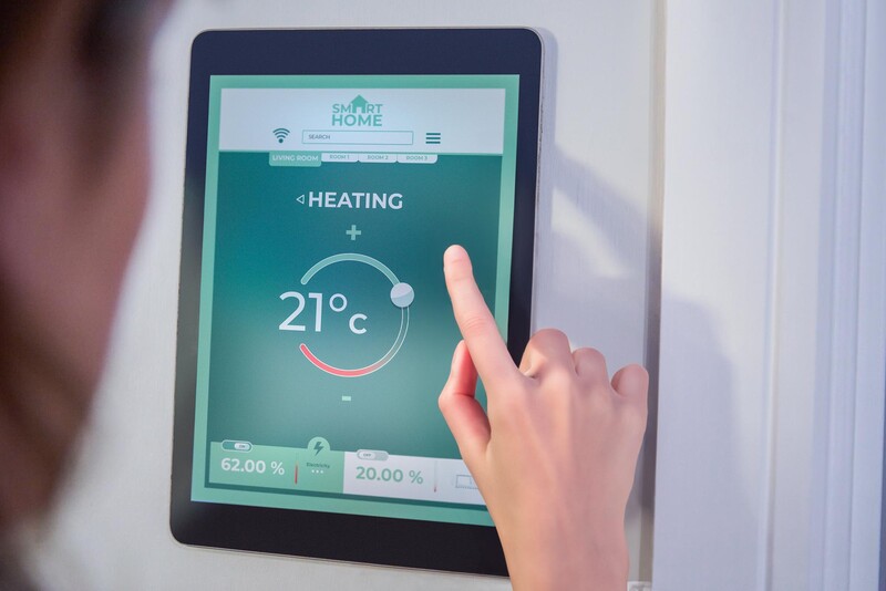 Person operating a heater via a touch screen