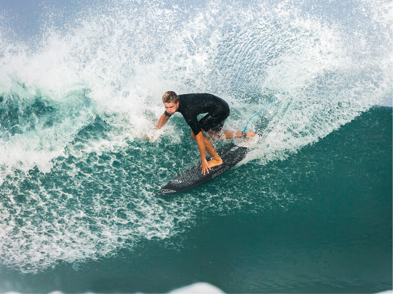 Man surfing a wave.