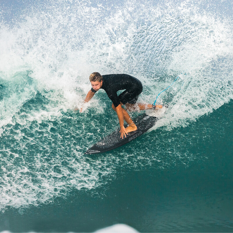 Man surfing a wave.